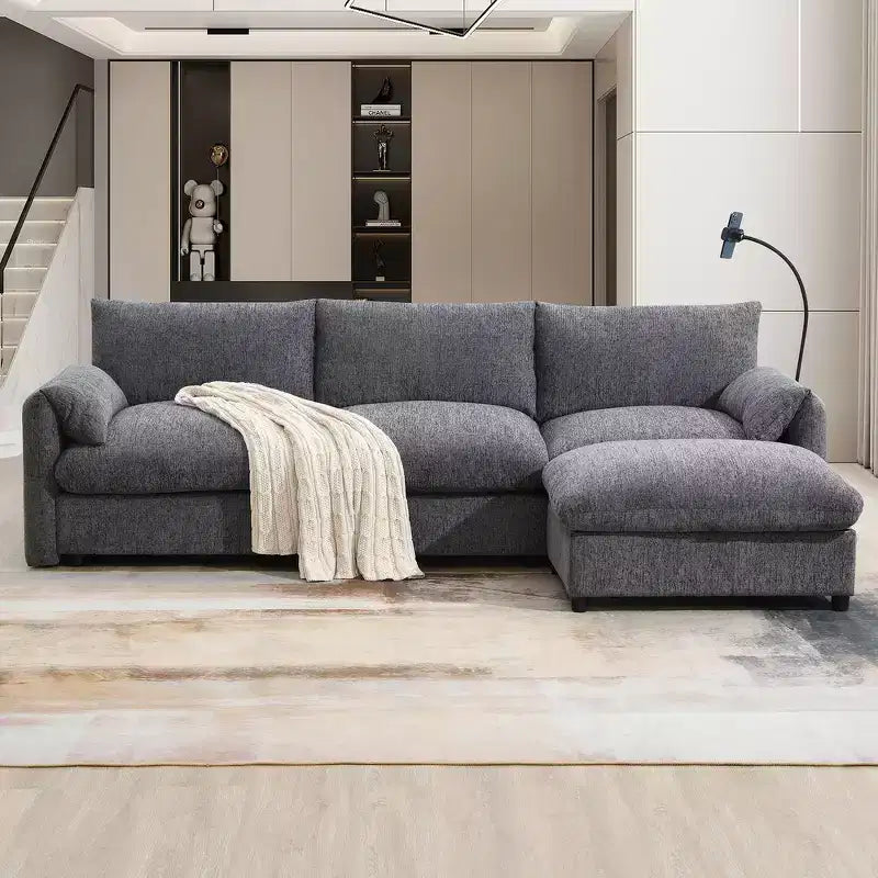 Divano sezionale in ciniglia oversize con pouf contenitore e tasche, porta telefono regolabile e porte di ricarica